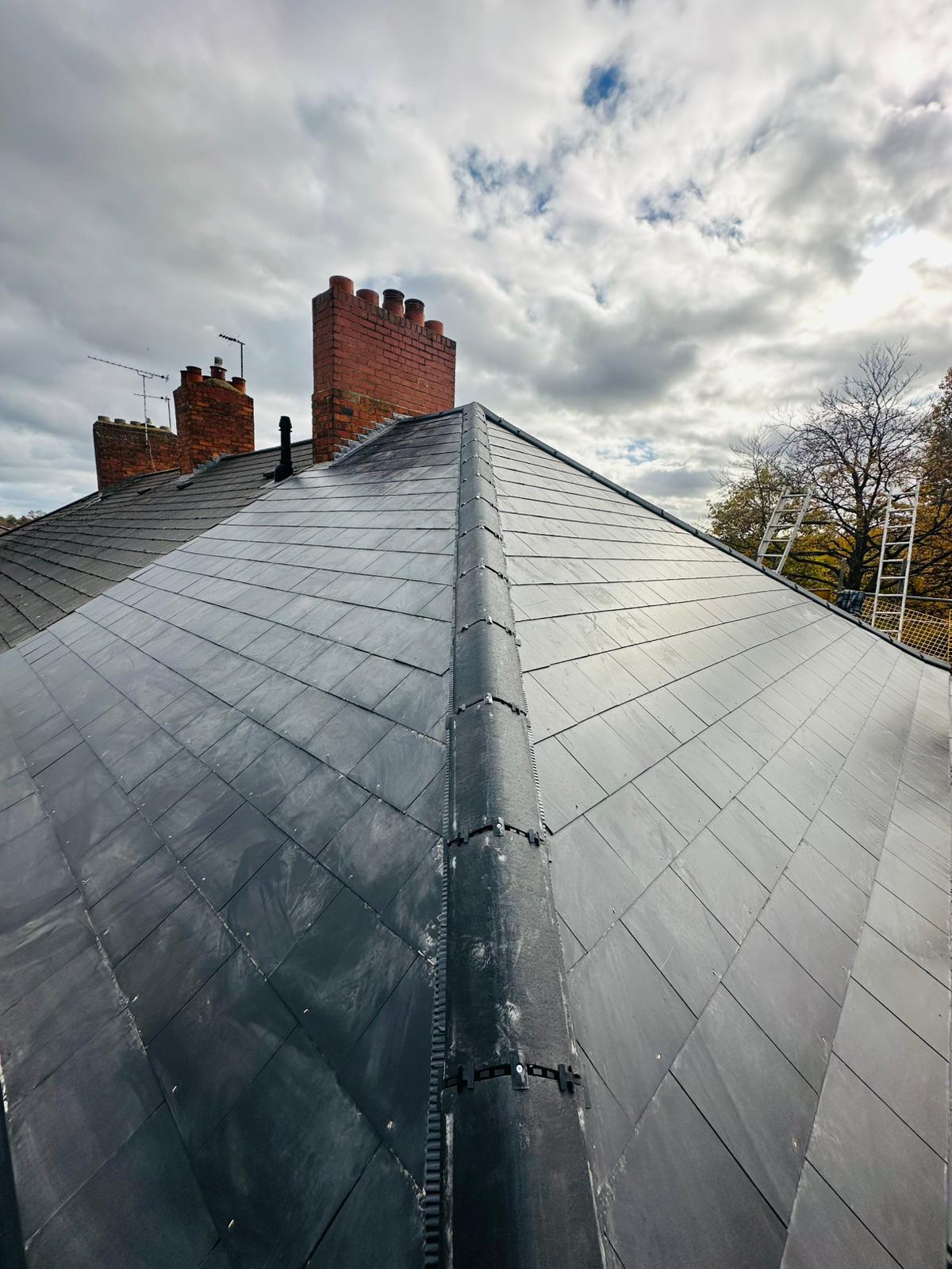 New Roof Installations in Worcester — Newly installed natural slate hipped roof with lead ridge detail, full re-roof by UK Roofing and Improvements Ltd