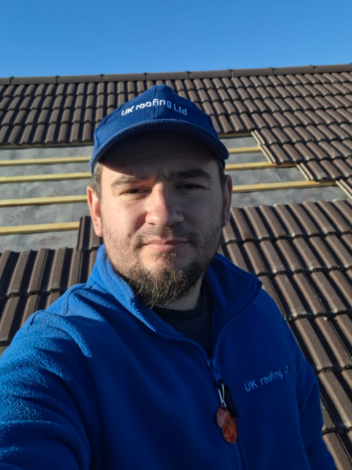 Jack, founder of UK Roofing and Improvements Ltd, on-site during a tile re-roof in Worcestershire