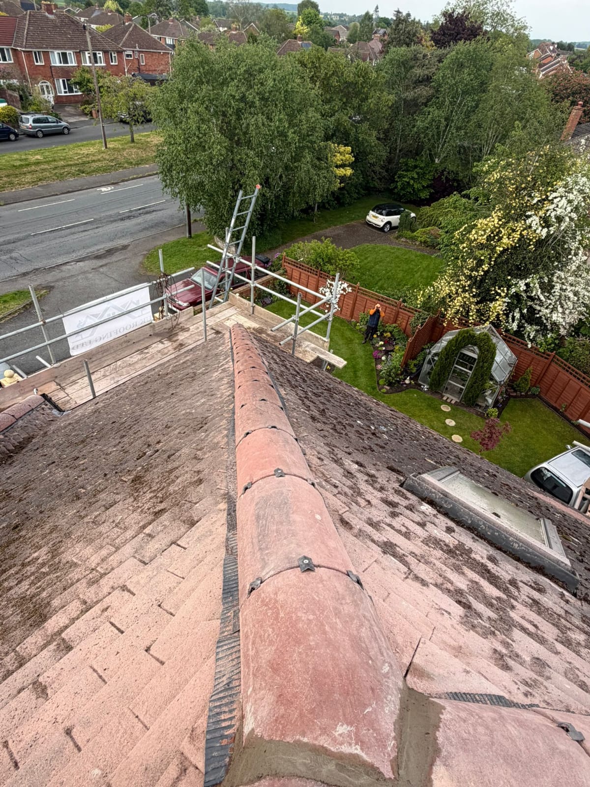 Aerial view of finished ridge re-bedding on a clay tile roof, Worcester