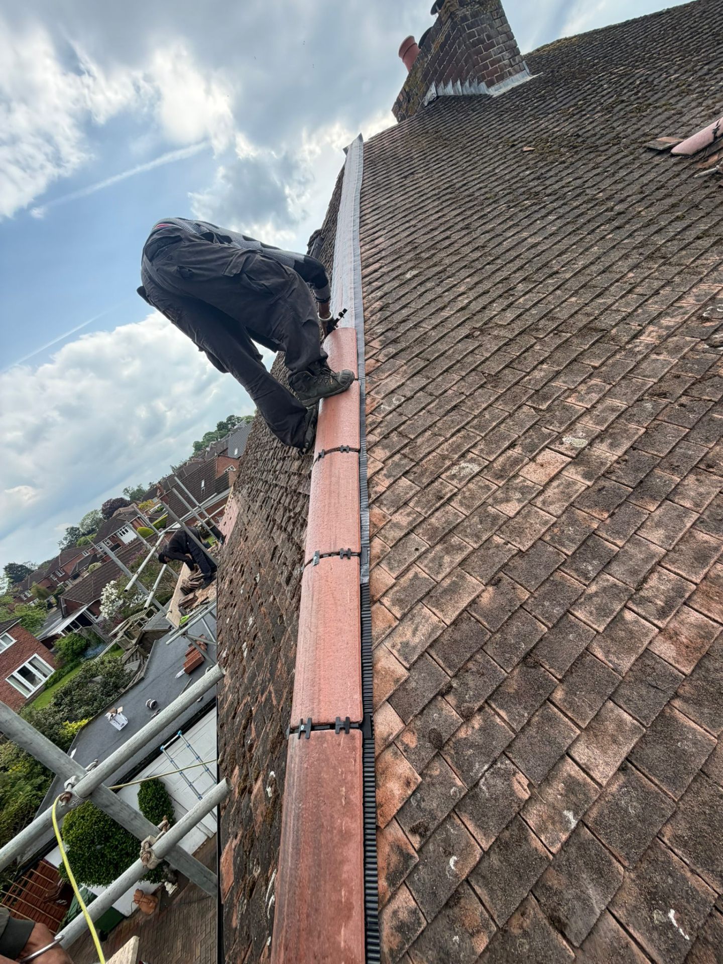 Dry-fix ridge tile installation on a plain clay tile roof