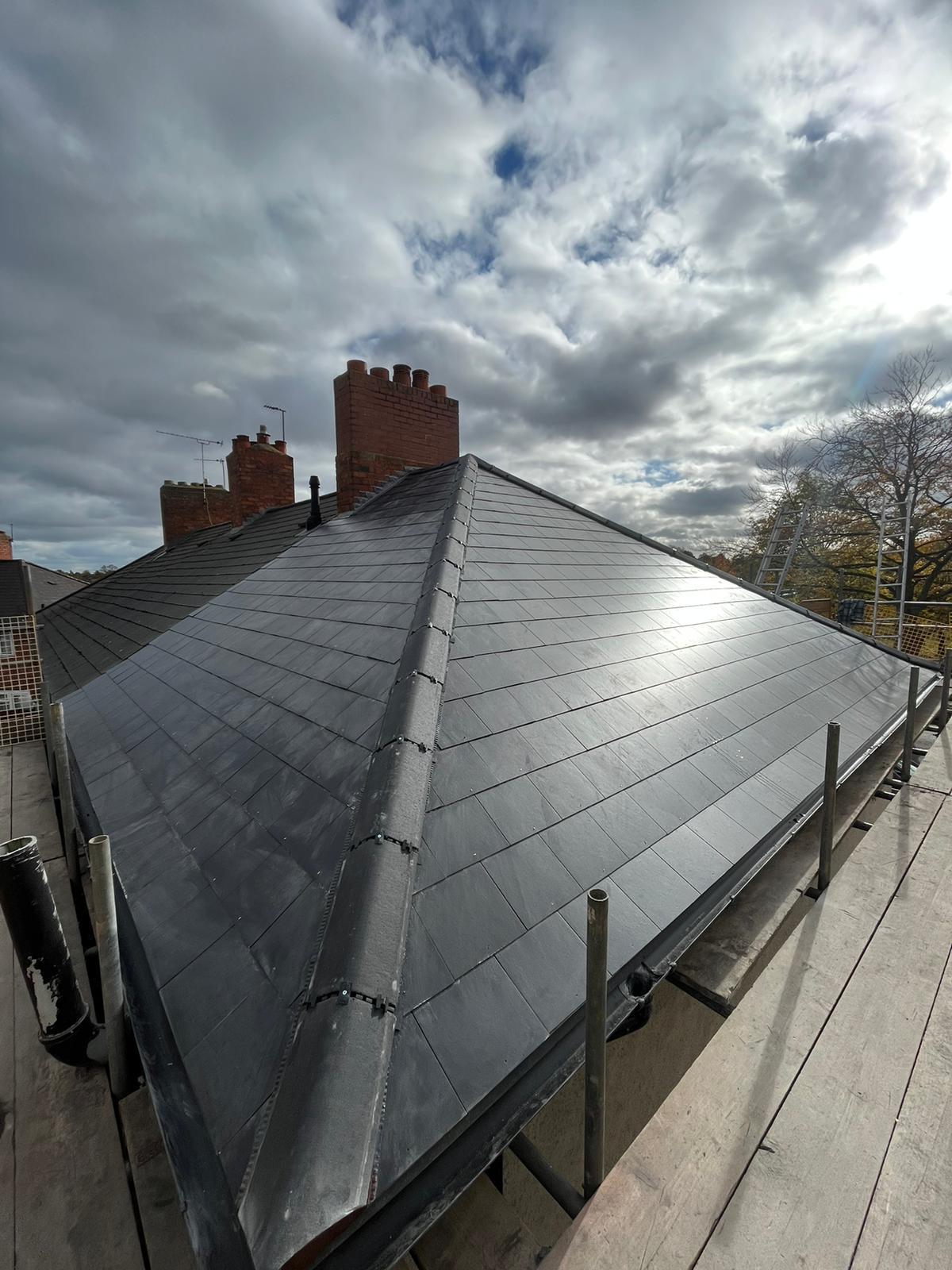 Modern dark slate hipped roof installation, full re-roof project